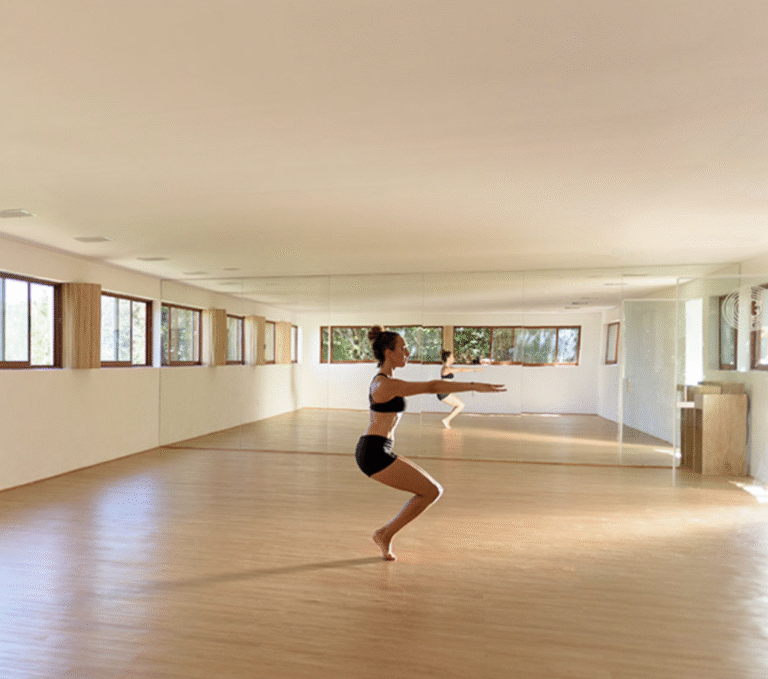 Woman in yoga pose on healing yoga retreat